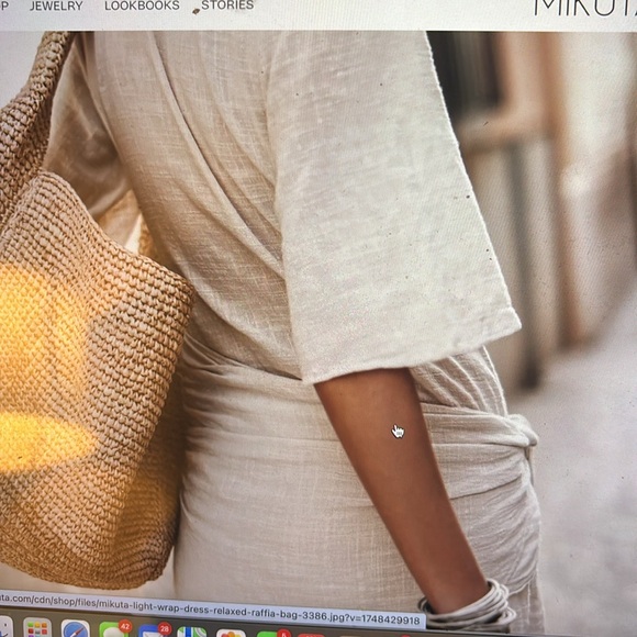 Mikuta black wrap dress sold out online sells for 220 when in stock. - Picture 14 of 16